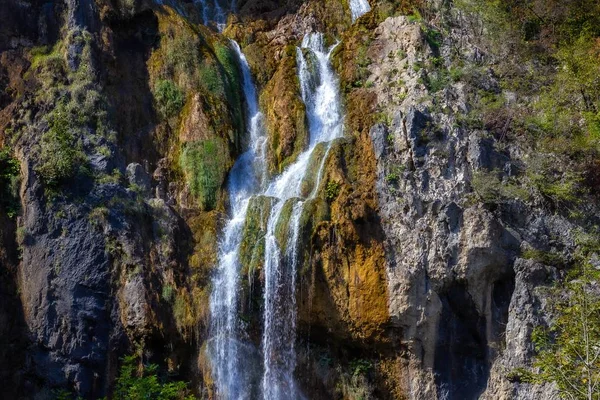 A breathtaking shot of a big waterfall in the rocks of Plitvice, Croatia