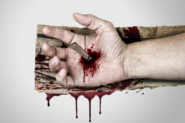 Bleeding hand of Jesus Christ nailed to the wooden cross — Stock Photo, Image