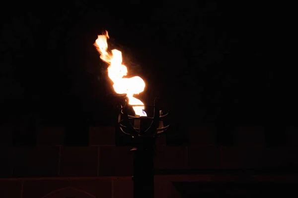 Retro lamp with a burning fire with black background — Stock Photo, Image