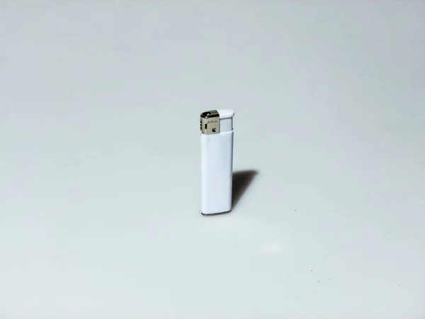 Isolated shot of a white lighter on white background — 스톡 사진