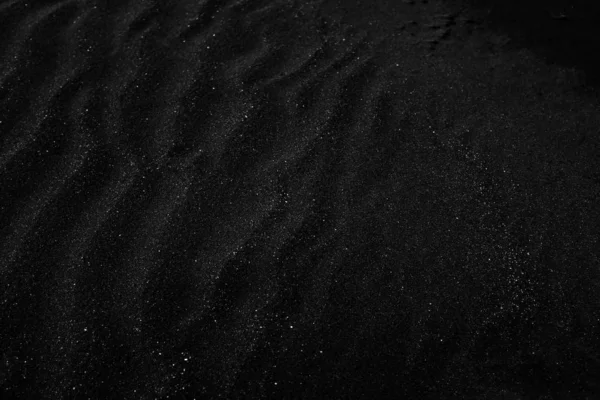 Fecho em escala de cinza de poeira preta e cinza sob a luz - um fundo fresco — Fotografia de Stock