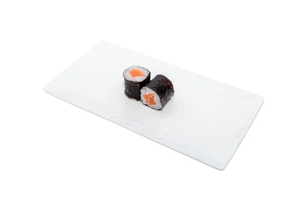 High angle shot of two philadelphia sushi rolls on a white tray isolated on a white background — Stock Photo, Image