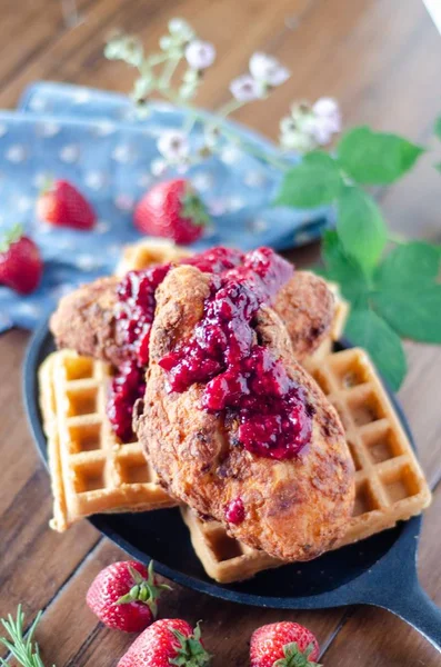 Vertical shot of delicious chicken and waffles with strawberry jam — ストック写真