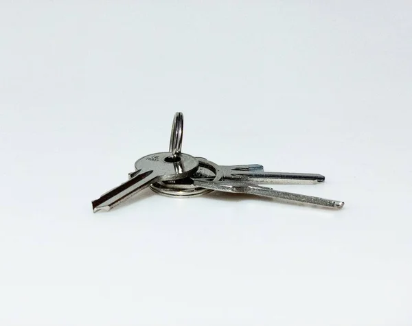 Isolated shot of a bunch of keys on white background — Stock Photo, Image