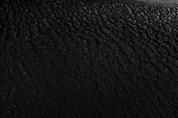 Closeup shot of wet black sand perfect for using a neutral background — Stock Photo, Image