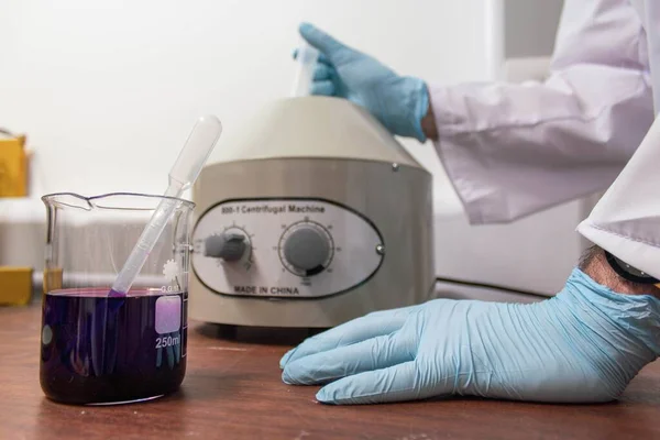 Man Inserting Purple Liquid Centrifuge Pipette — 스톡 사진