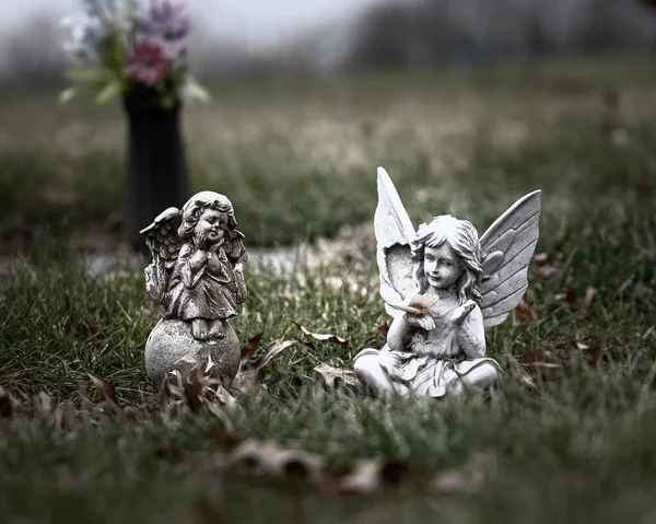 Two Angel Statues Grass Blurred Background — Stock Photo, Image