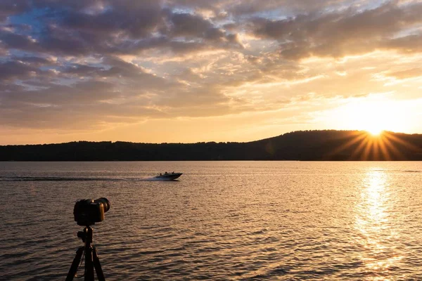 Camera Taking Shot Motorboat Sunset Background — 스톡 사진