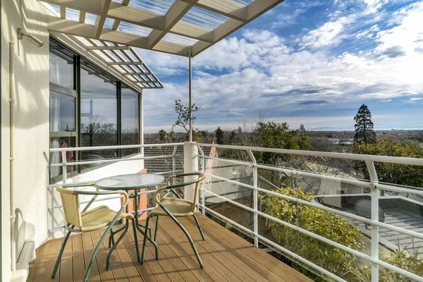 Small table with chairs in the balcony of a modern villa