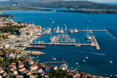 High angle shot of boats near the docks and buildings on the shore in Porto Montenegro, Kotor clipart