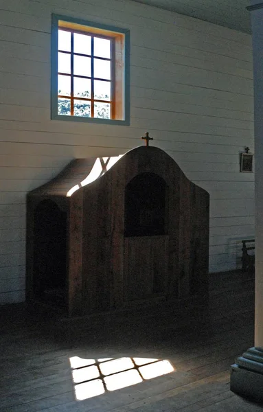 Vertical interior shot of a confession booth in the church — Stock Photo, Image