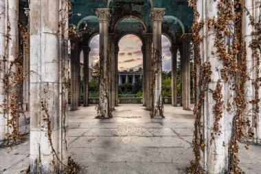 Historical Derelict Sanatorium Medea in Tskaltubo, Georgia during the sunset clipart