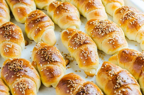 Closeup shot of delicious small croissants taken out from the oven - perfect for a food blog — Stock Photo, Image