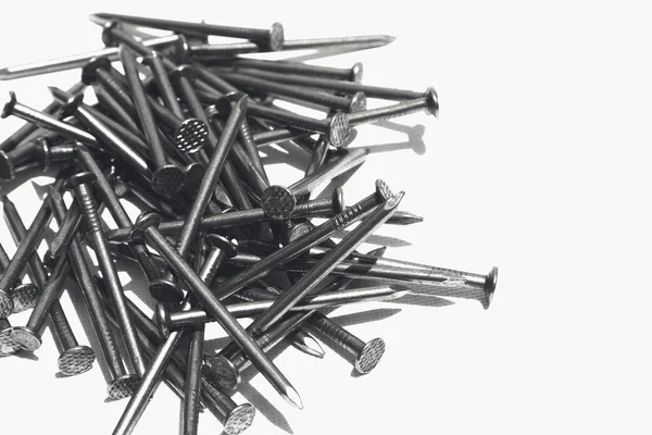 Een Close Shot Van Metalen Nagels Een Wit Oppervlak Geweldig — Stockfoto