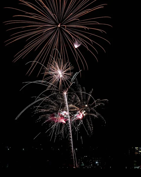 Beautiful shot of colorful fireworks in the night sky during holidays — Stock Photo, Image