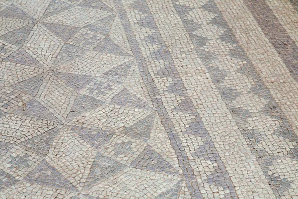 Closeup tiro de um antigo piso de mosaico na Grécia perfeito para usar como fundo — Fotografia de Stock