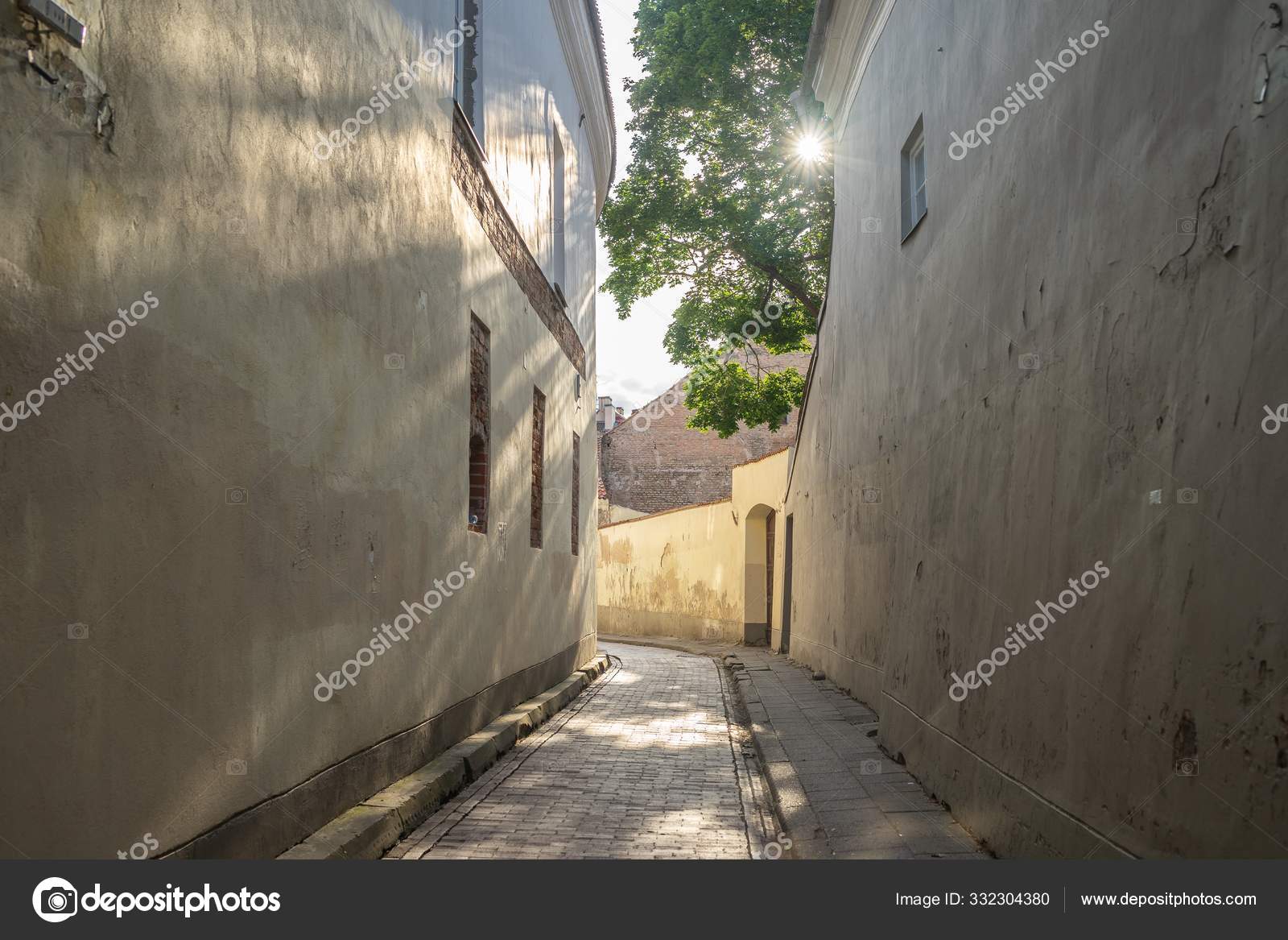 Alley Surrounded By Old Buildings And Greenery Under The Sunlight During Daytime Stock Photo Image By C Wirestock Alley Surrounded By Old Buildings And Greenery Under The Sunlight During Daytime Stock Photo Image By C Wirestock