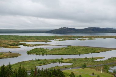 High angle shot of the beautiful landscape in Thingvellir, Iceland under the storm clouds clipart