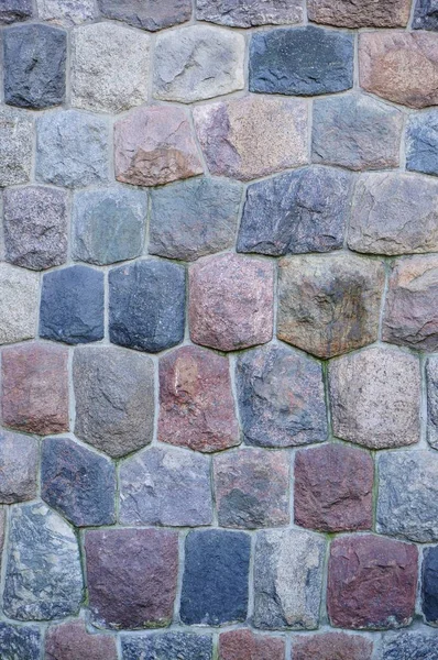 Függőleges Közelkép Egy Macskaköves Falról Színes Kövekkel — Stock Fotó