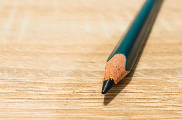 Closeup Shot Dark Green Pencil Wooden Surface — Stockfoto