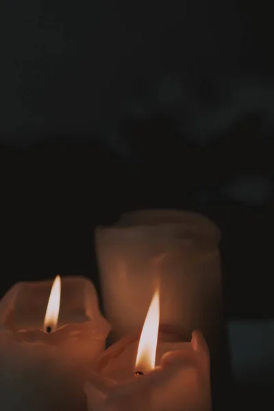 Closeup Shot Three Candles Put Next Each Other Dark — 스톡 사진