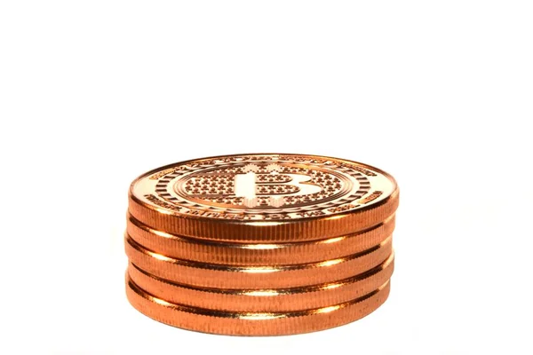 Closeup of bitcoins on top of each other under the lights against a white background — Stock Photo, Image