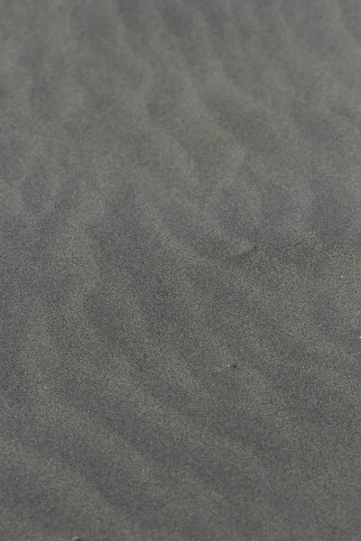 Imagen vertical de arena que cubre la playa bajo la luz del sol —  Fotos de Stock