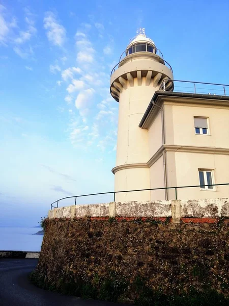 Vertical Shot Lighthouse Touching Clear Sky Beach San Sebastian Spain — Stock Photo, Image