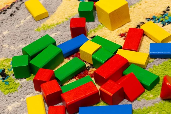 An overhead shot of different colors of a set of toys