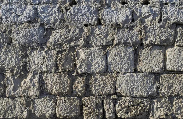 Closeup of an old grey  stone wall — Stock Photo, Image
