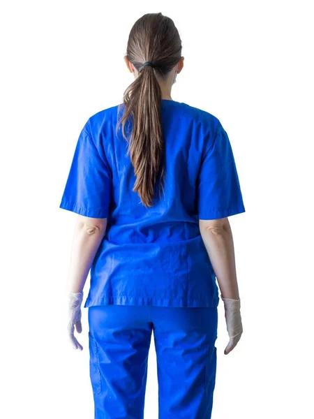 Tıbbi üniformalı ve maskeli bir doktor ameliyat için eldiven takıyor. — Stok fotoğraf