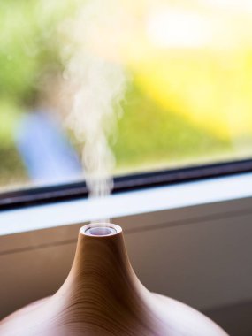 A closeup shot of an aroma smoke diffuser with a blurred background clipart