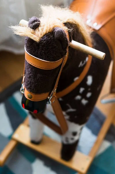 A vertical shot of a rocking horse for kids