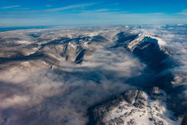 Aerial view of Mountains shrouded in fog - near Geneva clipart