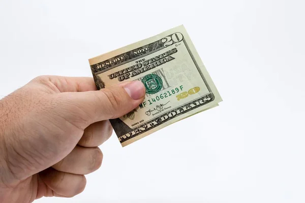 Κοντινό πλάνο ενός ατόμου που κρατάει ένα δολάριο πάνω από ένα λευκό φόντο — Φωτογραφία Αρχείου