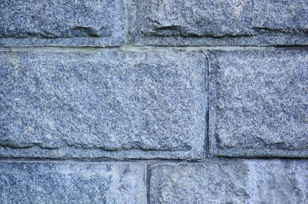 Closeup shot of a grey brick wall with rectangular tiles — Stock Photo, Image