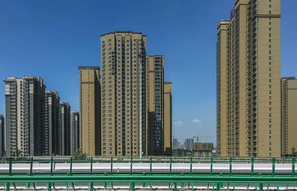 Wide angle shot of several skyscrapers built next to each other under during daytime — Stock Photo, Image