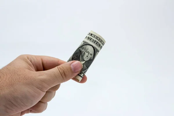 Крупный план человека с долларовой купюрой на белом фоне — стоковое фото