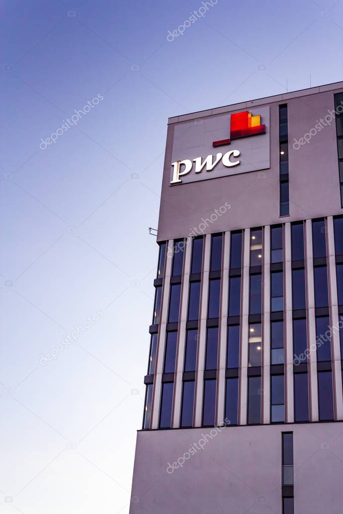 MUNICH, GERMANY - Jun 25, 2019: PwC tax office building in munich entry logo sign blue sky empty space