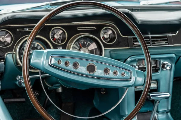 Closeup shot of a turquoise interior of a car, including the steering wheel — Stock Photo, Image