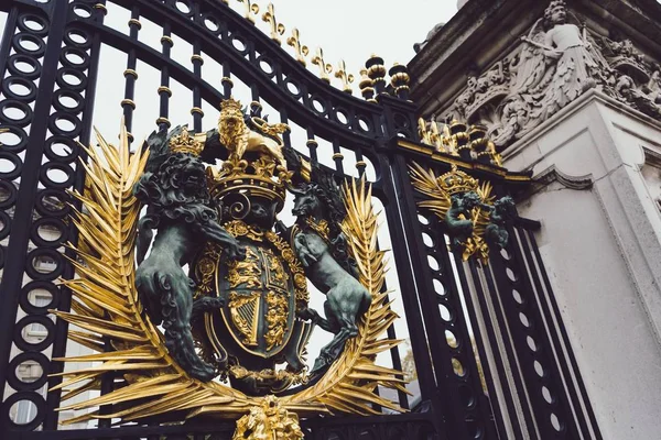 Closeup shot of the patterns and figures on a metal gate — Stock Photo, Image