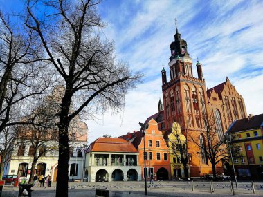 A beautiful shot of St. Mary's Church and colorful buildings in Stargard Poland clipart