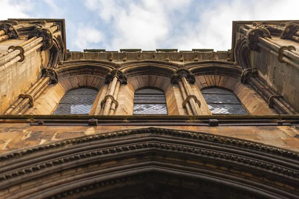 Low angle shot of a church with windows under the blue sky — Stock Photo, Image