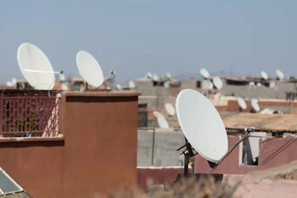 Selective focus shot of different building's roofs with antennas Stock Image