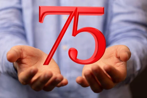 Red number 75 over someone's hand — Stock Photo, Image