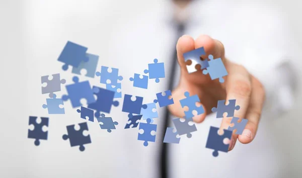 Person presenting a virtual projection of puzzles - business solution concept — Stock Photo, Image
