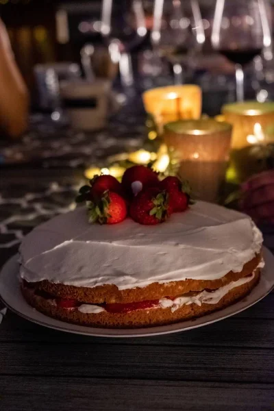 Closeup shot of a strawberry shortcake on an outdoor dinner table — Stock Photo, Image