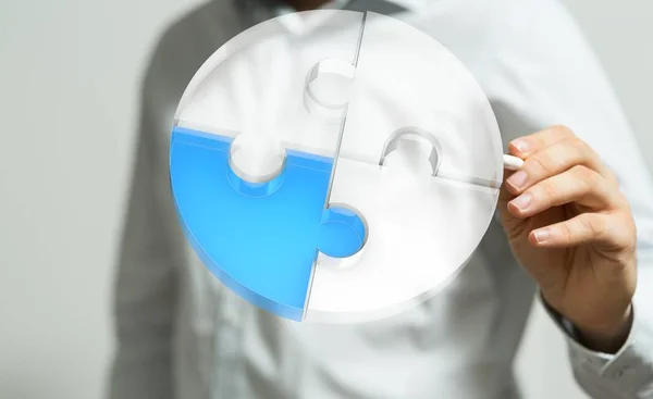 Person presenting a virtual projection of puzzles - business solution concept — Stock Photo, Image