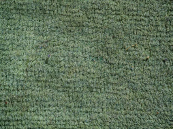 Foto de cierre de una textura de alfombra verde - perfecto para fondo — Foto de Stock