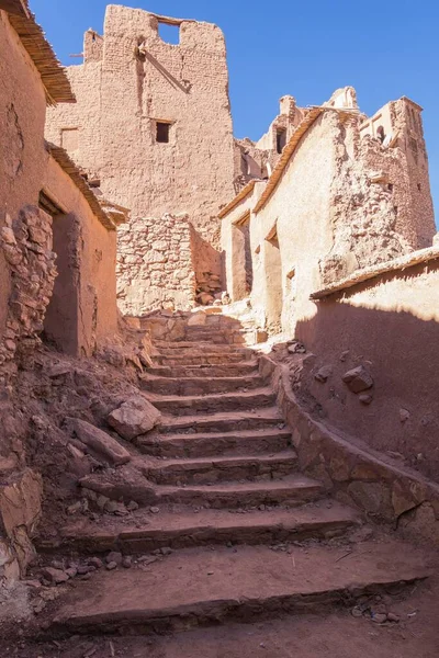 A vertical shot of ruined houses with stairs in Ait Ben Haddou kasbah, Morocco